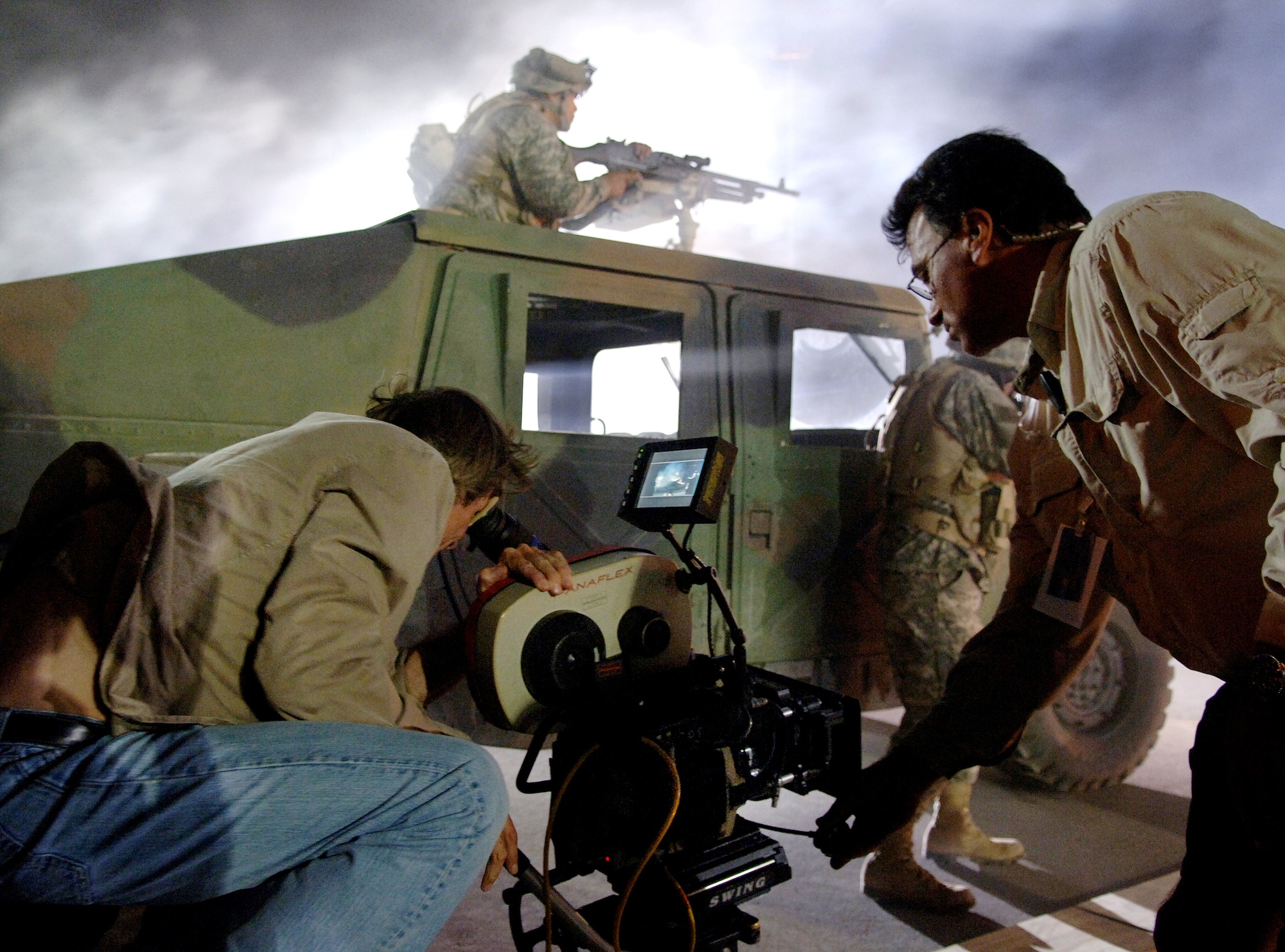 Movie director Michael Bay films an Airman on the set of the movie "Transformers" at Holloman Air Force Base, N.M., on May 31. Several Airmen had the opportunity to fill roles as extras during filming. The movie is scheduled for release in July 2007. (U.S. Air Force photo/Tech. Sgt. Larry A. Simmons)
