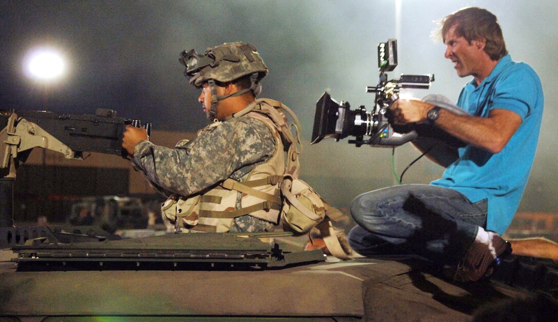 Movie director Michael Bay films an Airman on the set of the movie "Transformers" at Holloman Air Force Base, N.M., on May 30. Several Airmen filled roles as movie extras. The movie is scheduled for release in July 2007. (U.S. Air Force photo/Tech. Sgt. Larry A. Simmons)
