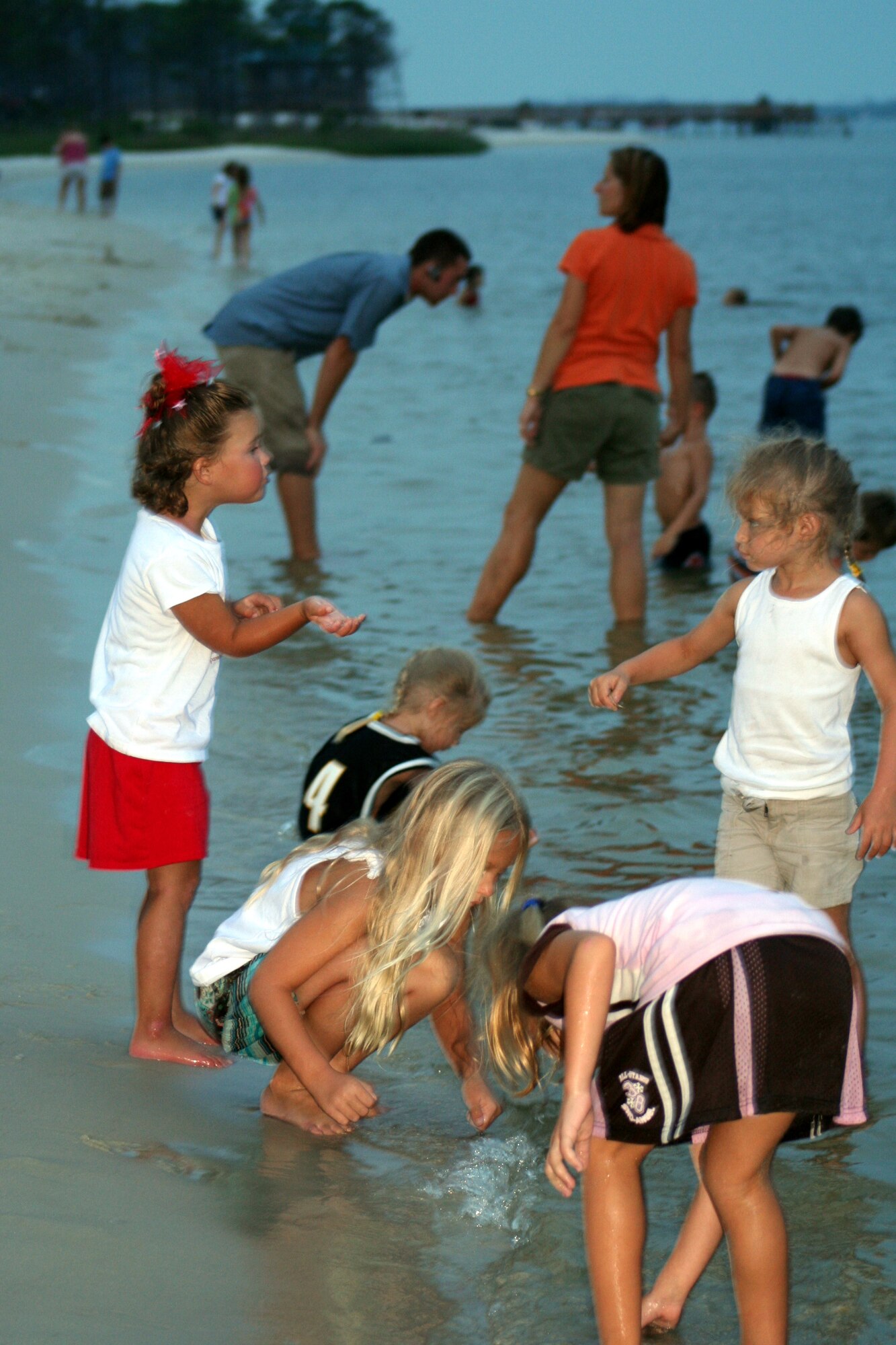 Children play in the water before the fireworks display at the Sound of Independence July 1. (U.S. Air Force Photograph by Staff Sgt. Kelly Ogden)