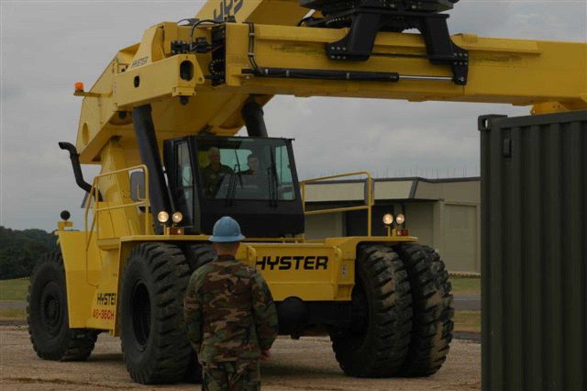 Lt. Gen. Robert D. Bishop Jr., Air Command Europe commander and USAFE vice commander, (seated left) maneuvers a 100K forklift with a little help from Staff Sgt. Gary Zimmerman (seated right) and Airman 1st Class Scottie Eubanks, both from the 420th Munitions Squadron.  General Bishop stopped by Royal Air Force Welford during a recent visit to seven geographically separated units in England. (U.S. Air Force photo/Amn. Austrie Martinez)

