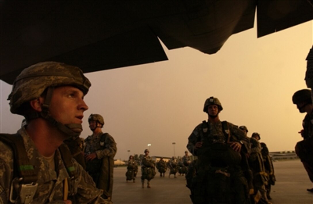U.S. Army soldiers load onto a C-130 Hercules aircraft during Exercise Joint Forcible Entry at Pope Air Force Base, N.C., on June 27, 2006. The exercise is a U.S. Army and Air Force joint airdrop exercise designed to enhance inter-service cohesiveness. The soldiers are assigned to the 1st Battalion, 508th Paratrooper Infantry Regiment and 2nd Battalion, 321st Airborne Field Artillery from Fort Bragg, N.C. 