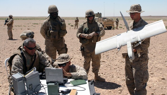 Colonel Ronald J. Johnson, commanding officer 24th Marine Expeditionary Unit, is briefed on the "Dragoneye" unmanned aerial drone at Camp Al Qatranah, Jordan, during Exercise Infinite Moonlight 2006.