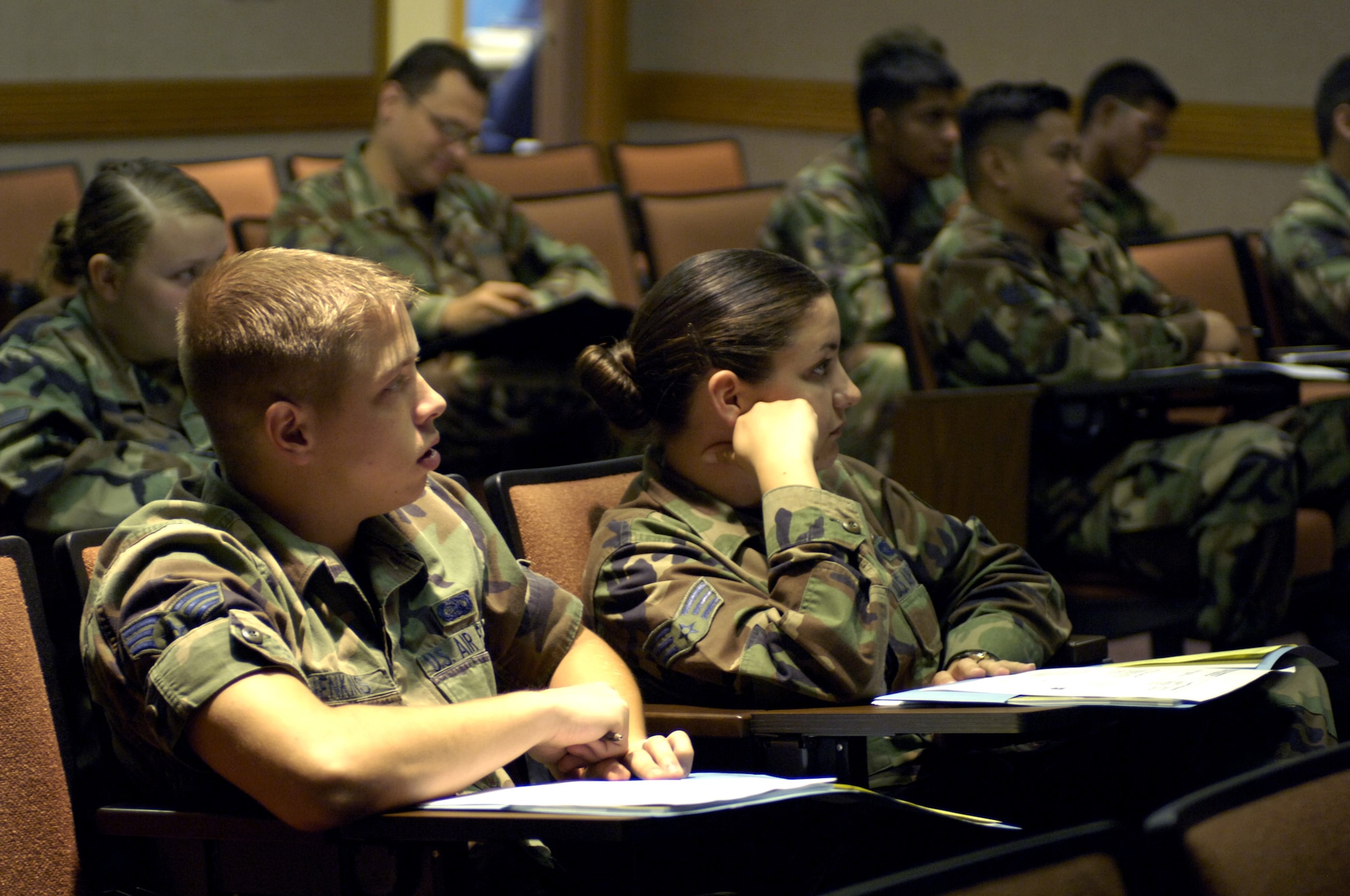 HICKAM AIR FORCE BASE, Hawaii -- Airmen listen to a briefing being held at the Professional Military Education building during an Airman Professional Enhancement Course 11 July 2006 at Hickam Air Force Base, Hawaii. The development course is held once a quarter and targets Airmen who have been in the Air Force for two to four years. The course is meant to fill the gap between the Airman First Term Center and Airman Leadership School. (U.S. Air Force photo/ Tech. Sgt. Shane A. Cuomo)
