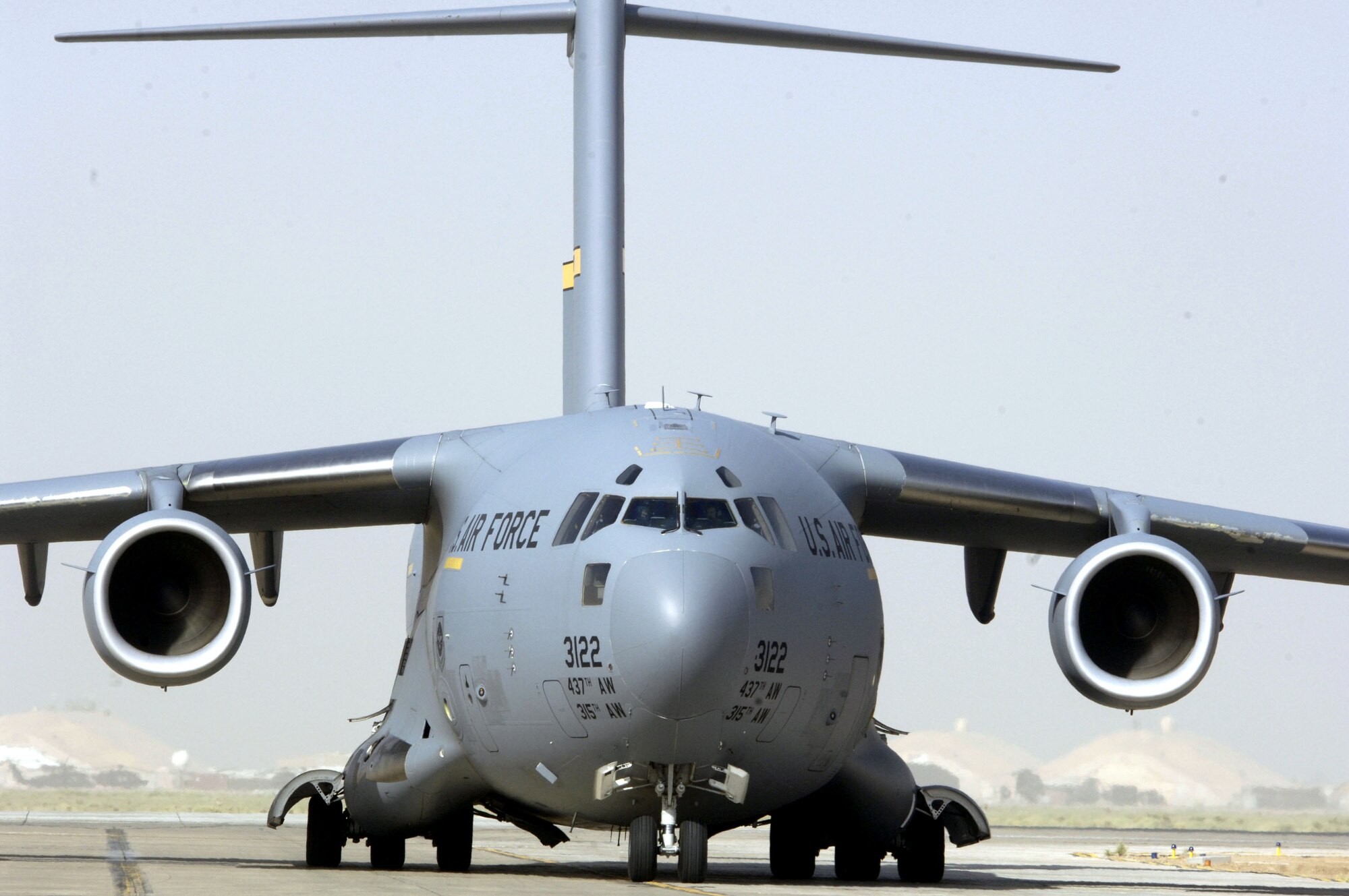 A C-17 Globemaster III taxis onto the parking ramp at Balad Air Base, Iraq, on July 12 after flying a mission in support of Operation Iraqi Freedom. (U.S. Air Force photo/Airman 1st Class Andrew Oquendo)

