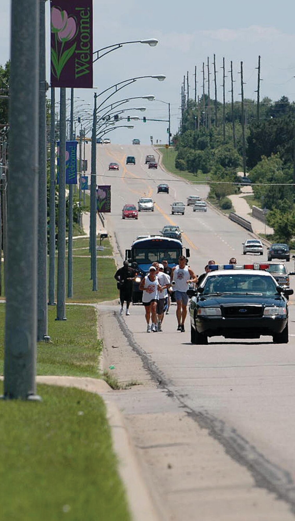 931st SF members run with Derby police during the Special Olympics torch run on June 2 in Derby, Kan.