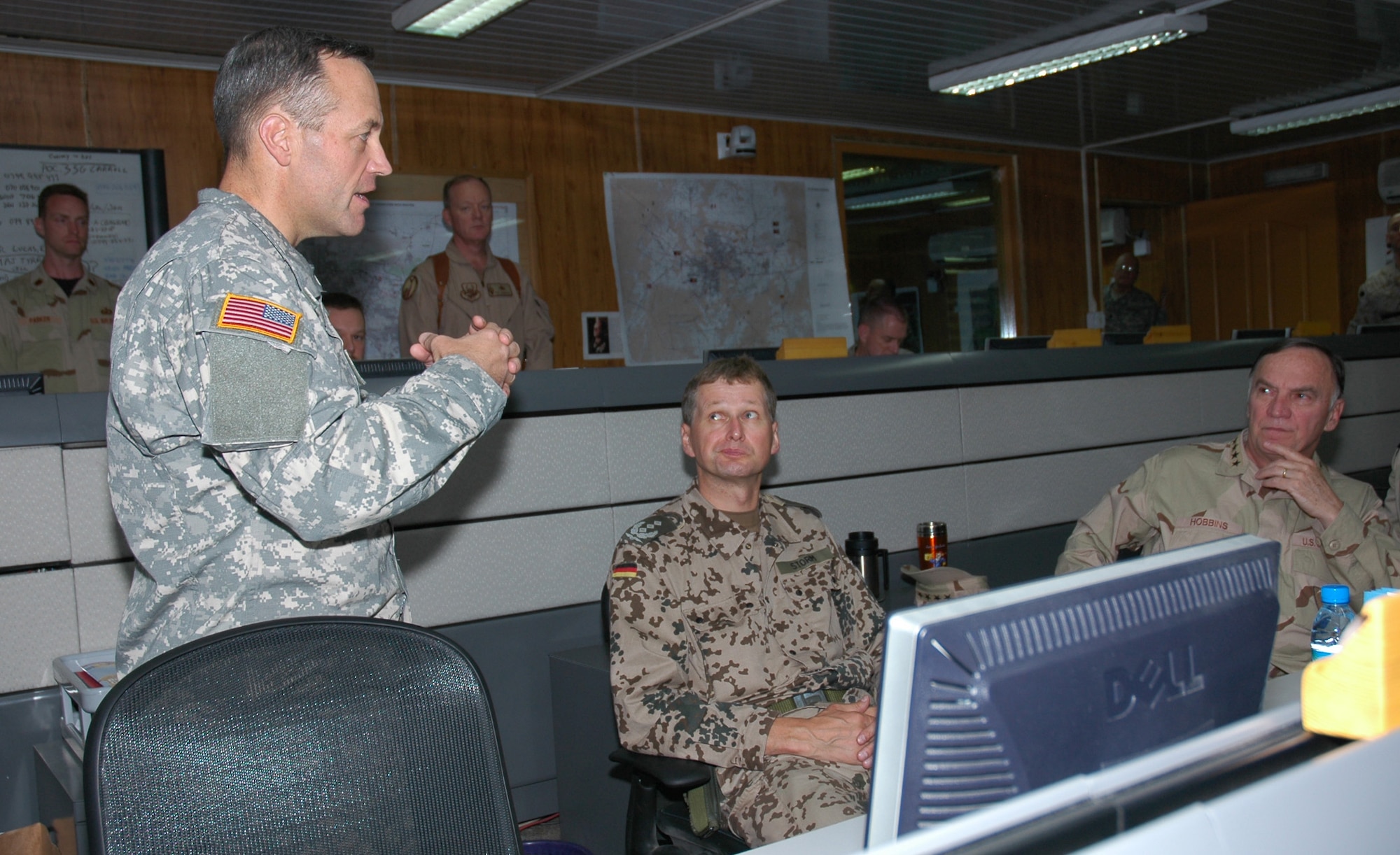 Col. David Anderson (left), Combined Forces Command CJ3, briefs Gen. Tom Hobbins (right), U.S. Air Forces in Europe and Allied Air Component Command Ramstein commander, and German Air Force Col. Helmar Storm, executive officer to the Allied Air Component Command Ramstein commander, during the general's July 5 visit. (U.S. Air Force photo/Capt. Elizabeth Culbertson)
