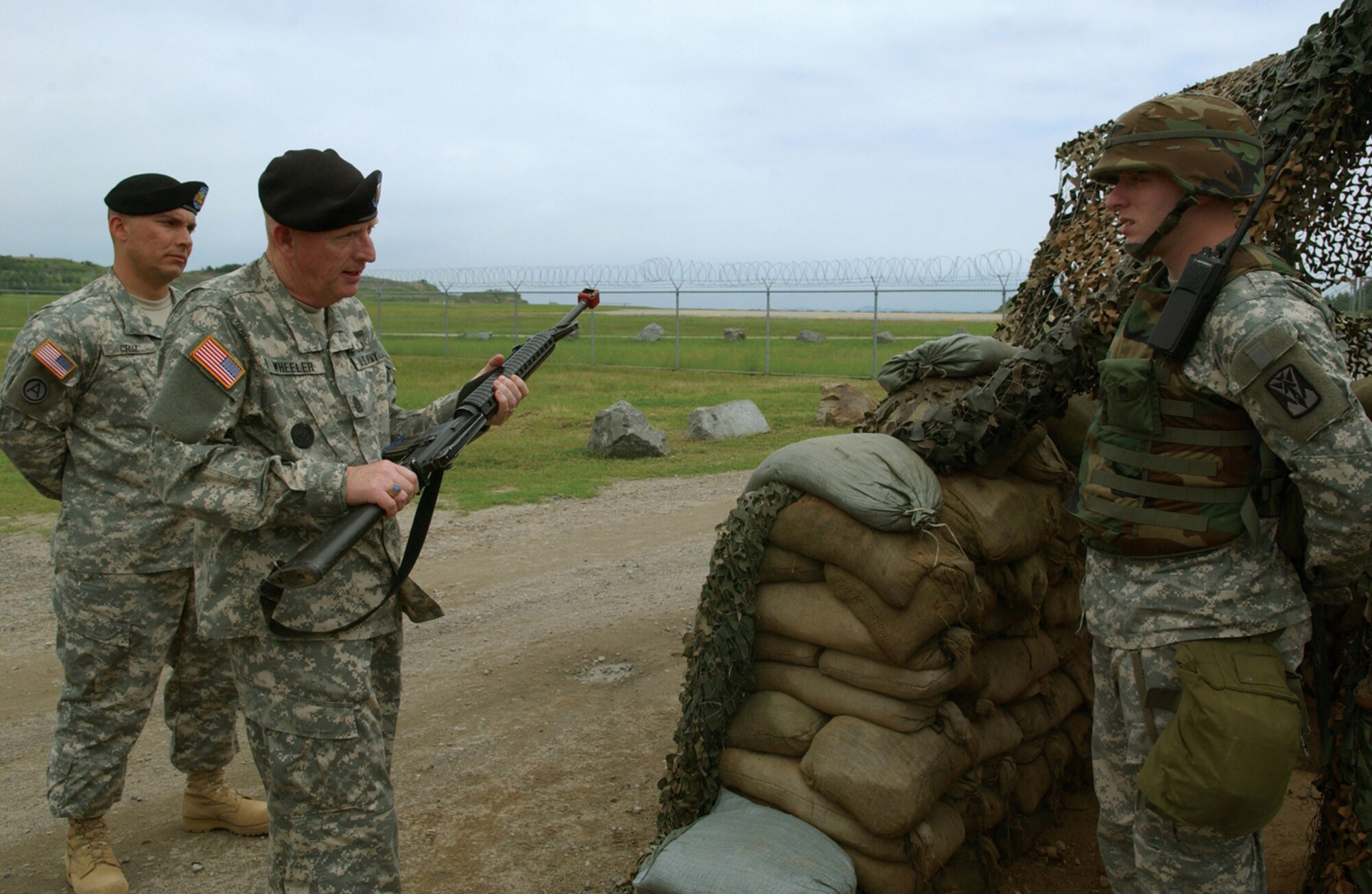 KUNSAN AIR BASE, Republic of Korea -- Sgt. Maj. Barry Wheeler, United States Forces Korea command sergeant major, reviews an air defense artillery soldier July 5. (Air Force photo by Staff Sgt. Josef Cole)                              