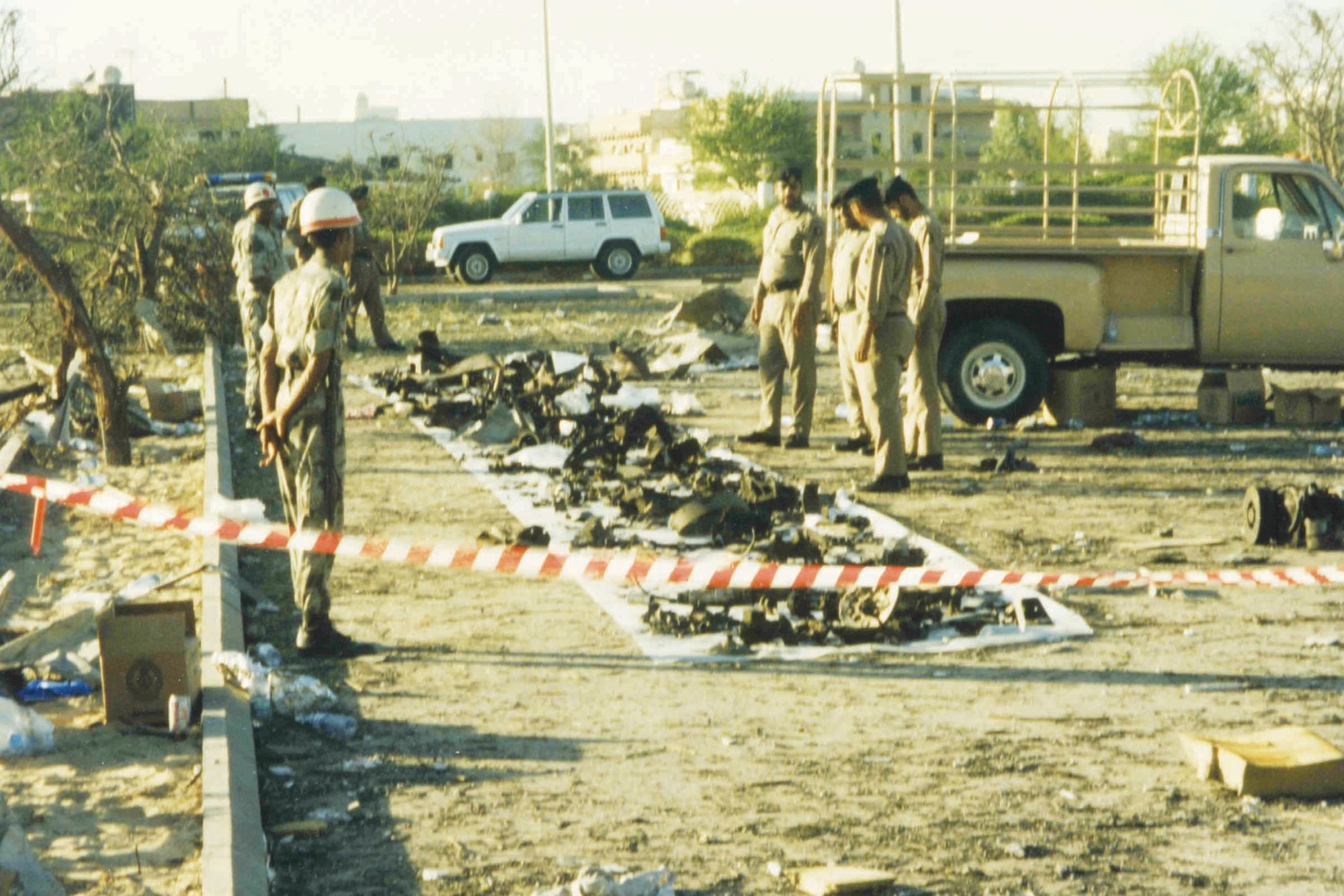 Saudi Arabian military personnel guard what is left of the truck the terrorists filled with explosives to bomb Khobar Towers.  (Courtesy photo)