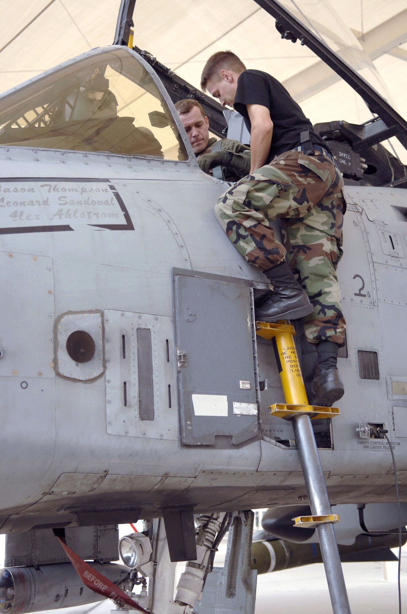Airman 1st Class Brett Davis helps Lt. Col. Francis McDonough as he prepares for a mission in an A-10 Thunderbolt II at Davis-Monthan Air Force Base, Ariz., on July 7. Colonel McDonough is assigned to the 355th Wing  and was recently deployed to Bagram Air Base, Afghanistan, in support of Operation Enduring Freedom. Airman Davis is a crew chief with the 354th Aircraft Maintenance Unit. (U.S Air Force photo/Senior Airman Christina D. Ponte)