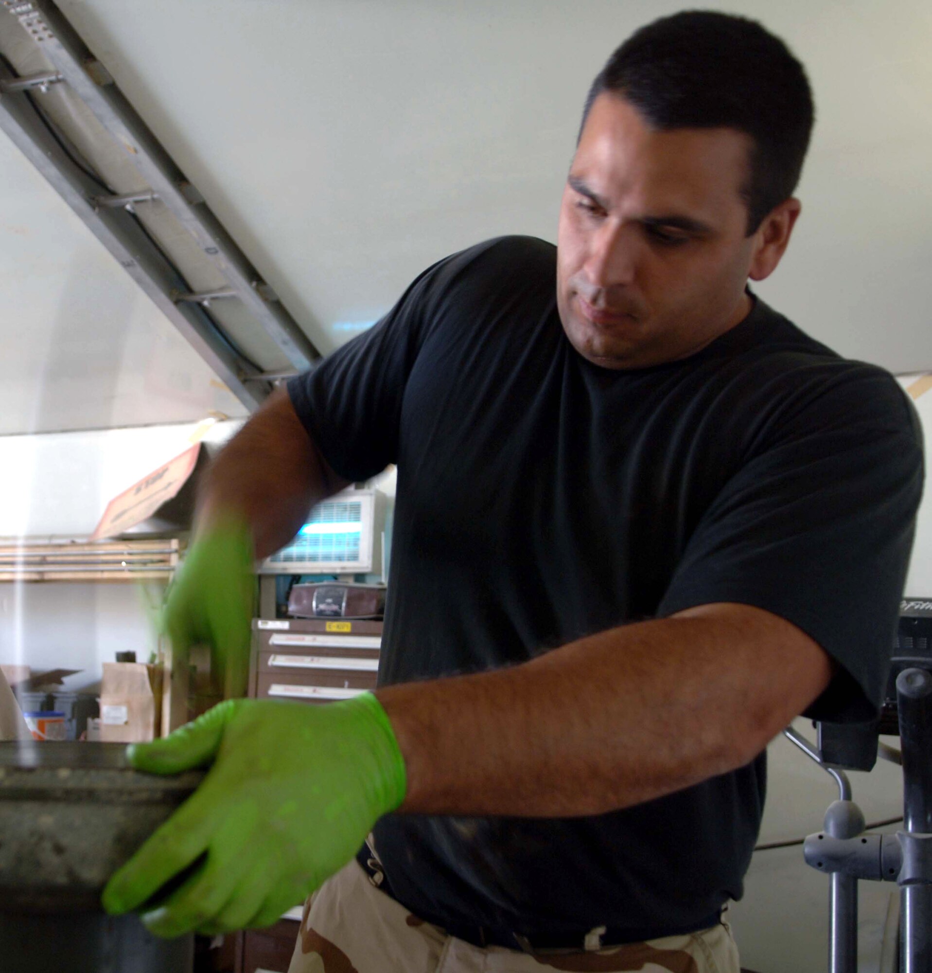 Staff Sgt. James McCall uses a mallet to install a bearing assembly into the wheel of a trailer used to transport bombs and other ordnance on July 7. Sergeant McCall is an Air Force Reserve munitions specialist deployed to Bagram Air Base, Afghanistan. He and other munitions flight members receive, inspect, store, assemble and deliver munitions for use on aircraft and in small arms. (U.S. Air Force photo/Maj. David Kurle)