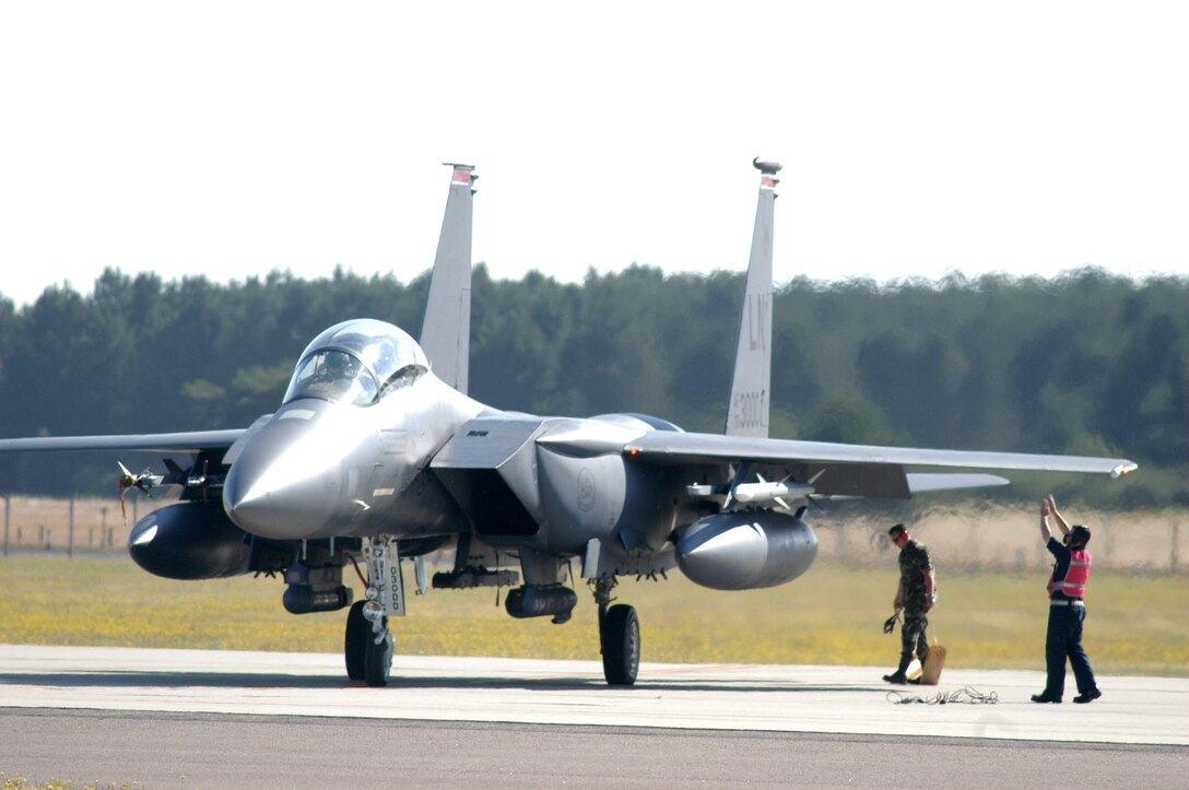 A modified F-15E Strike Eagle, assigned to the 494th Fighter Squadron, launched on an operational training mission from Royal Air Force Lakenheath, England, on Monday, July 10, with the bomb release unit-61. The aircraft was one of four to participate in the first training mission with the new technology. The BRU-61 carries the newest small-diameter bomb, the guided bomb unit-39, into battle when the unit deploys in September. (U.S. Air Force photo/Airman 1st Class Michael Hess)