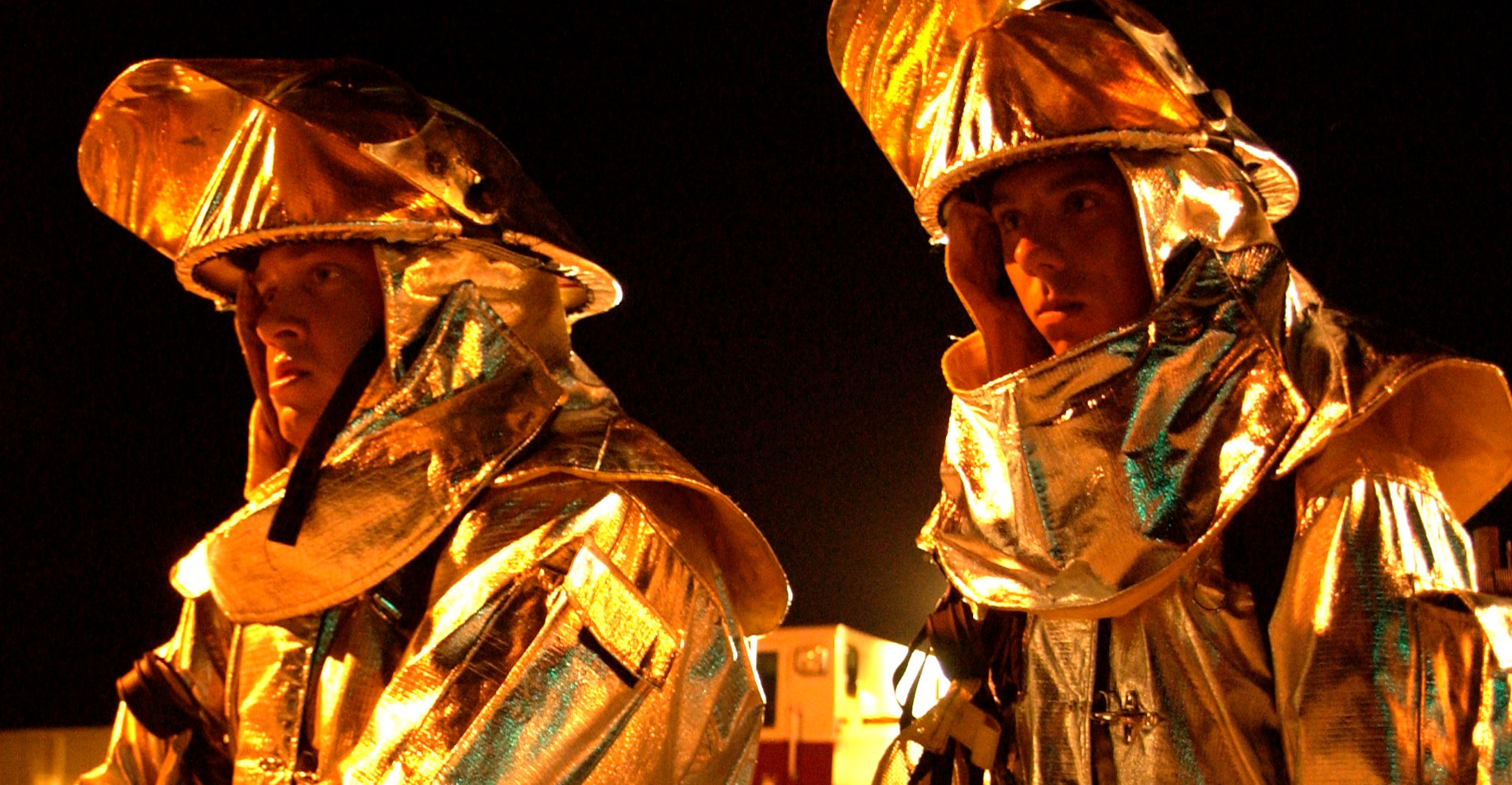 Airman 1st Class Kyle Houseman (left) and Airman Basic Mark Maslowski respond to a simulated vehicle accident at Andersen Air Force Base, Guam, during the Beverly Palm 06-07 exercise on July 10. The exercise is held several times a year to sharpen the mobility and wartime capabilities of Airmen. The Airmen are assigned to the 36th Civil Engineer Squadron. (U.S. Air Force photo/Airman 1st Class Miranda Moorer) 