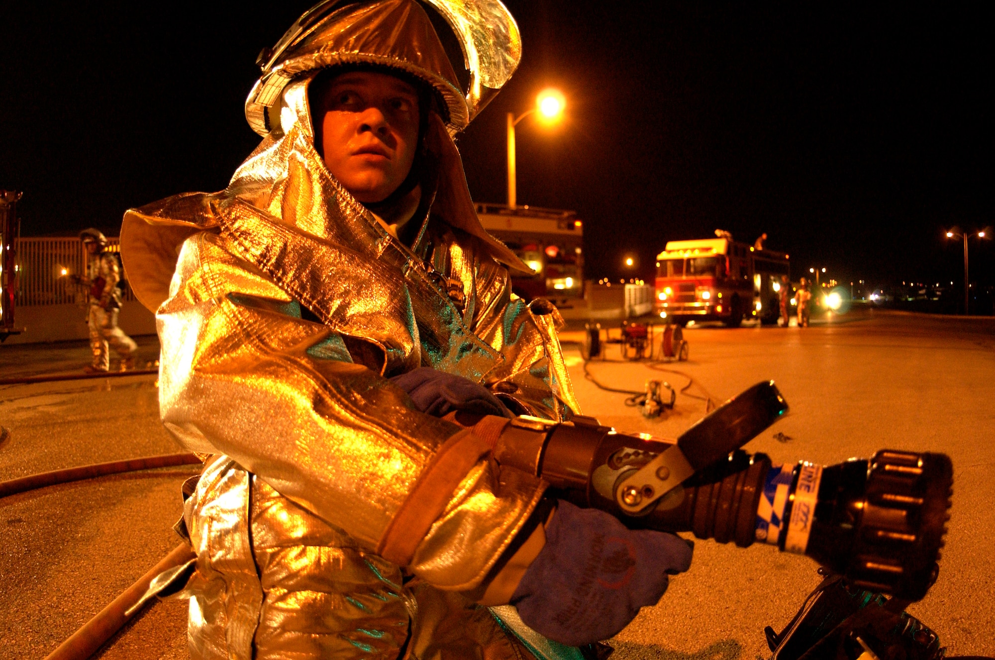 Airman 1st Class Kyle Houseman responds to a simulated vehicle accident at Andersen Air Force Base, Guam, during the Beverly Palm 06-07 exercise on July 10. The exercise is held several times a year to sharpen the mobility and wartime capabilities of Airmen. Airman Houseman is assigned to the 36th Civil Engineer Squadron. (U.S. Air Force photo/Airman 1st Class Miranda Moorer)