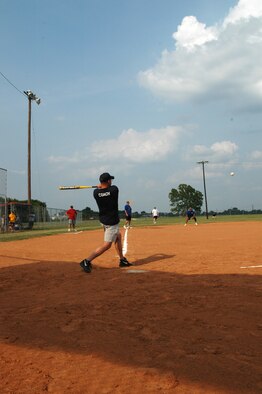 Mike Rowlands, a major and commander of the 917th Logistics Readiness Squadron, hits a base hit during the 917 LRS vs. 717th Aircraft Maintenance Squadron baseball game Saturday, July 8. The 917 LRS came out victorious with a score of 9-5. (U.S. Air Force photo/Tech. Sgt. Sherri Savant)