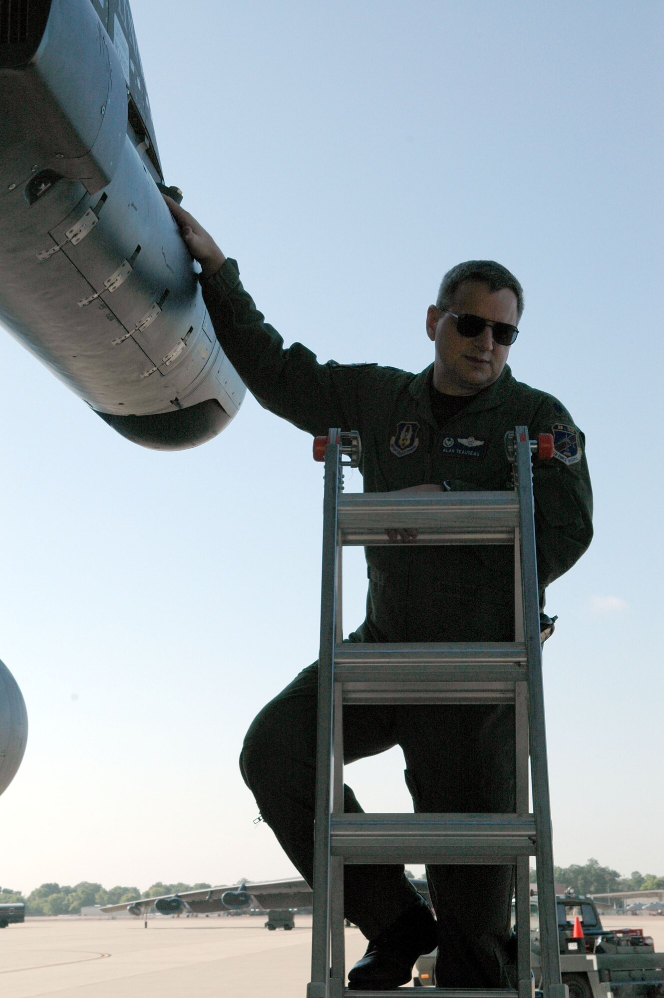 Lt. Col. Al Teauseau, 93rd Bomb Squadron commander, manually checks the latches on the LITENING AT targeting pod to verify they are properly engaged prior to the last flight needed to achieve combat-capable status. The 93rd Bomb Squadron is the first B-52 squadron to be LITENING pod combat capable. (U.S. Air Force photo/1st Lt. Torri White)