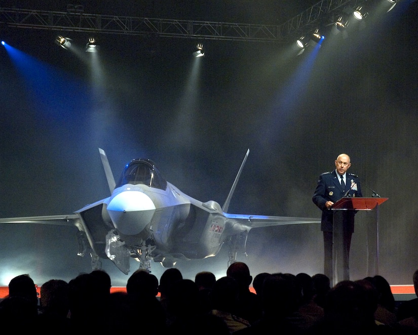 Air Force Chief of Staff Gen. T. Michael Moseley announces Lightning II as the name selected for the new Lockheed Martin F-35 during the inauguration ceremony at the Lockheed Martin plant in Fort Worth, Texas, on July 7. (Image photo/Lockheed Martin) 