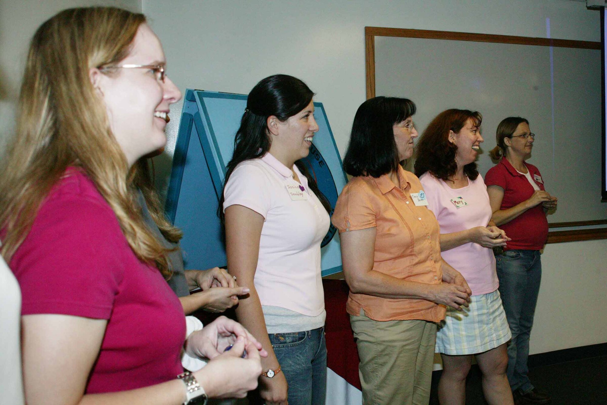 Spouses sing the Air Force song Tuesday during Heart Link. Heart Link, a program offered by the Airman and Family Readiness Center, is designed to introduce military spouses to the Air Force way of life. (U.S. Air Force photo/Tarsha Storey)