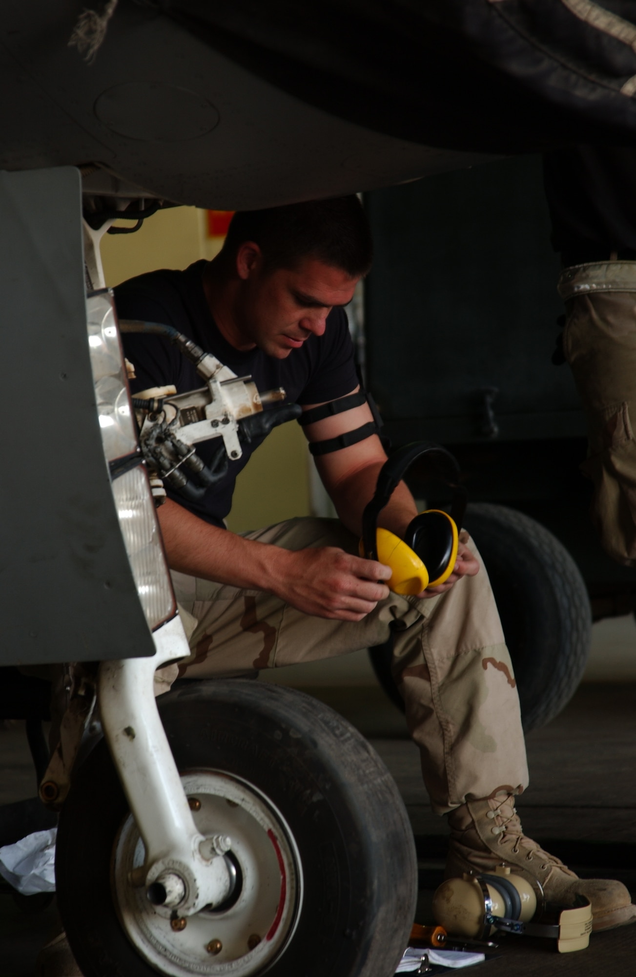 Airman 1st Class James Ballard, 332d Expeditionary Maintenance Squadron, studies the technical orders of an F-16. The phase teams work around the clock to get two squadrons of F-16s inspected and flying in three days on average. (U.S. Air Force photo/SrA Kerry Solan-Johnson)