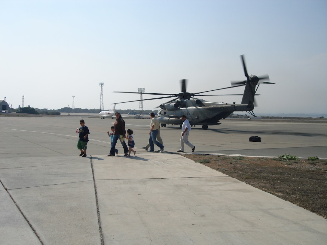 U.S. citizens exit a CH-53 transport helicopter in Cyprus following their departure from the U.S. embassy in Beirut, Lebanon.::n::The 24th Marine Expeditionary Unit is assisting in the transport of American citizens wishing to leave Lebanon.