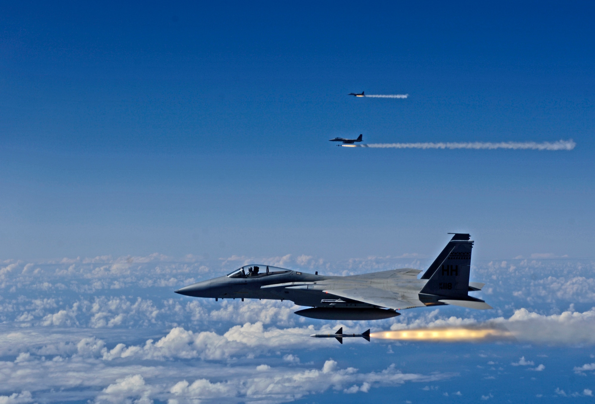 HICKAM AIR FORCE BASE, Hawaii -- F-15 Eagles fire AIM-7 Sparrow missiles at a tactical air-launched decoy July 16, 2006 during Rim of the Pacific Exercise 2006 off the cost of Hawaii. The F-15s are from the Hawaii Air National Guard 199th Fighter Squadron and will be firing 14 live missiles at two decoy targets. RIMPAC 2006 brings friendly forces from the Pacific theater and the United Kingdom together to engage in air and sea war games. (U.S. Air Force photo/ Tech. Sgt. Shane A. Cuomo)
