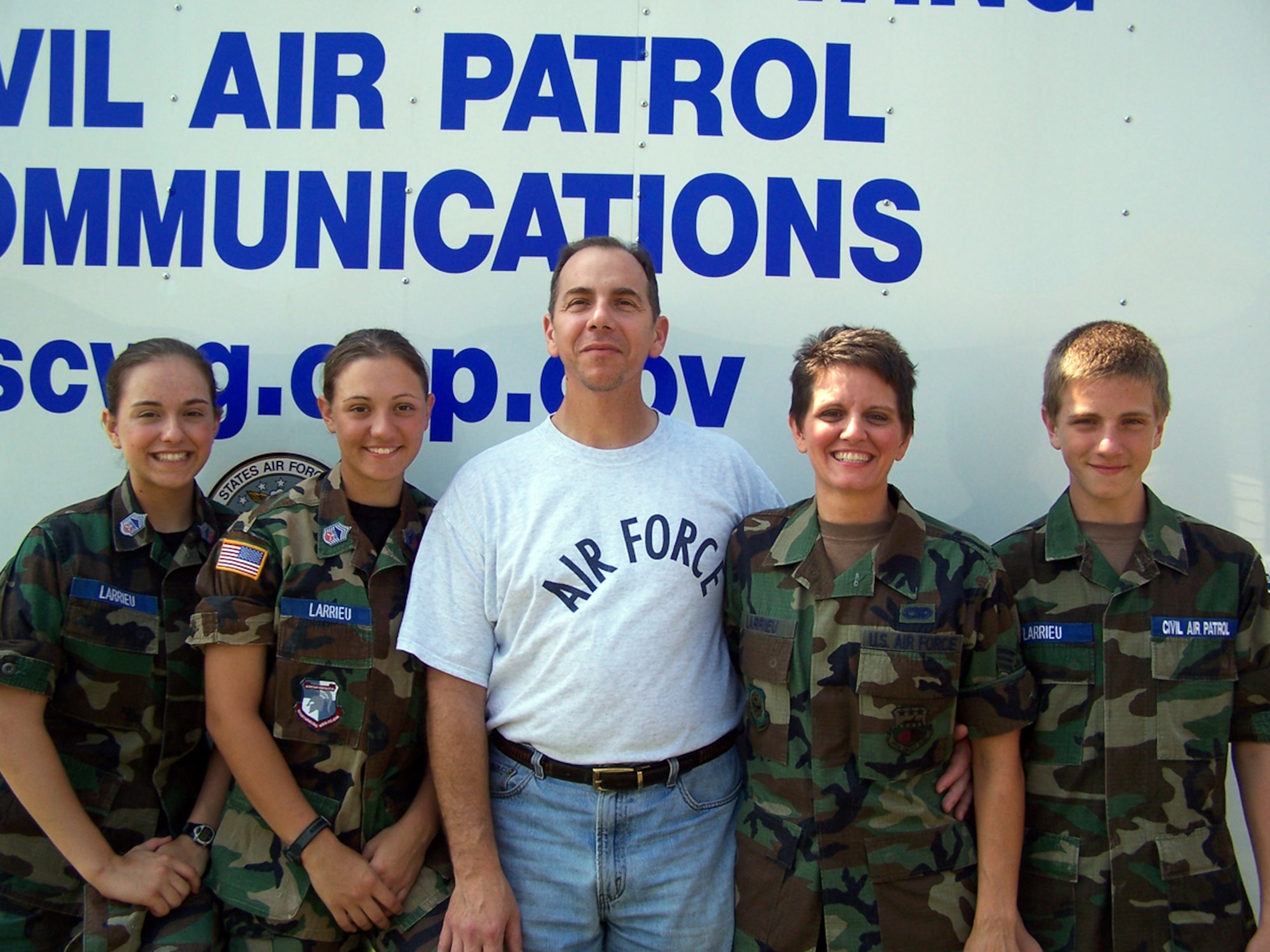 Family business: (left to right) Civil Air Patrol Chief Master Sgt. Mary Cathrine Larrieu, Chief Master Sgt. Sarah Larrieu, Airman 1st Class Conrad Larrieu, 2nd Lt. Dawn Larrieu, and Airman 1st Class Nicholas Larrieu participated in “Encampment 2006.”  Lieutenant Larrieu is also a senior airman with the 81st Aerial Port Squadron. (Photo by Chief Master Sgt. Charlie Hall Jr., USAFR)