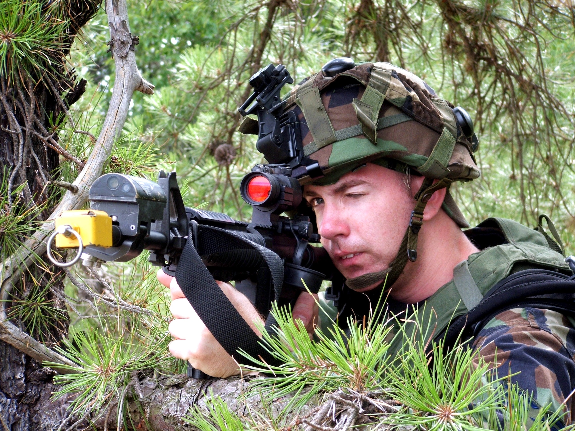 Senior Airman Daniel Brown watches over a perimeter area during operations for exercise Eagle Flag 06-3 at Naval Air Engineering Station Lakehurst, N.J., on Saturday, July 15. The exercise is the only flag-level exercise that tests Airmen from multiple Air Force specialties on their expeditionary combat support skills. The exercise is coordinated by the Air Mobility Warfare Center's 421st Combat Training Squadron. Airman Brown is assigned to the 305th Security Forces Squadron at McGuire Air Force Base, N.J. (U.S. Air Force photo/Tech. Sgt. Scott T. Sturkol)