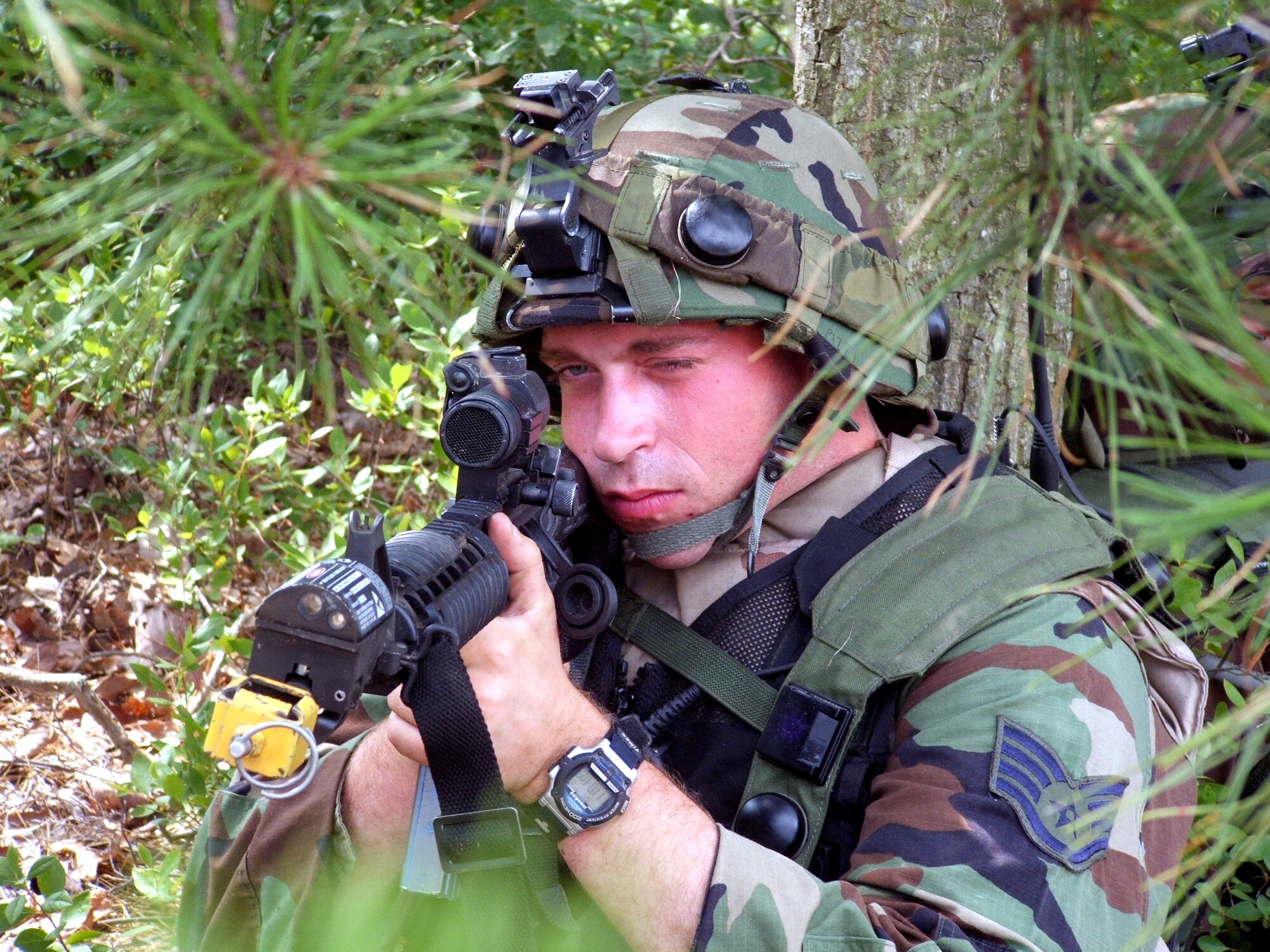 Staff Sgt. Nic Pizzi watches over a perimeter area during operations for exercise Eagle Flag 06-3 at Naval Air Engineering Station Lakehurst, N.J., on Saturday, July 15. The exercise is the only flag-level exercise that tests Airmen from multiple Air Force specialties on their expeditionary combat support skills. The exercise is coordinated by the Air Mobility Warfare Center's 421st Combat Training Squadron. Sergeant Pizzi is assigned to the 817th Global Mobility Squadron at McGuire Air Force Base, N.J. (U.S. Air Force photo/Tech. Sgt. Scott T. Sturkol)
