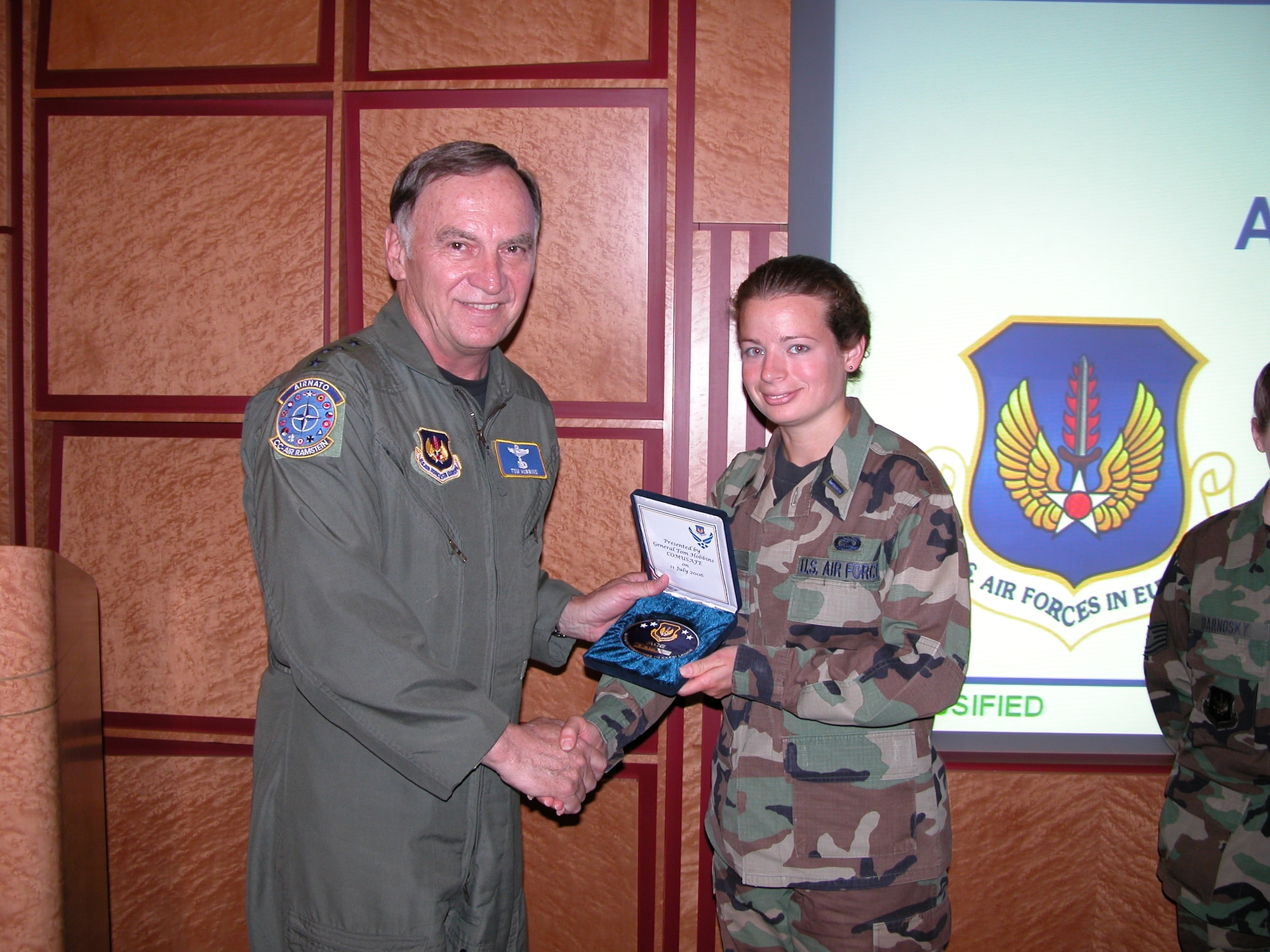 1st Lt Katie Serrano, USAFE Command Center, receives an ACE award from Gen. Tom Hobbins, United States Air Forces, Europe commander.  The lieutenant earned the ACE for her work on a recent Joint Chiefs of Staff inspection.