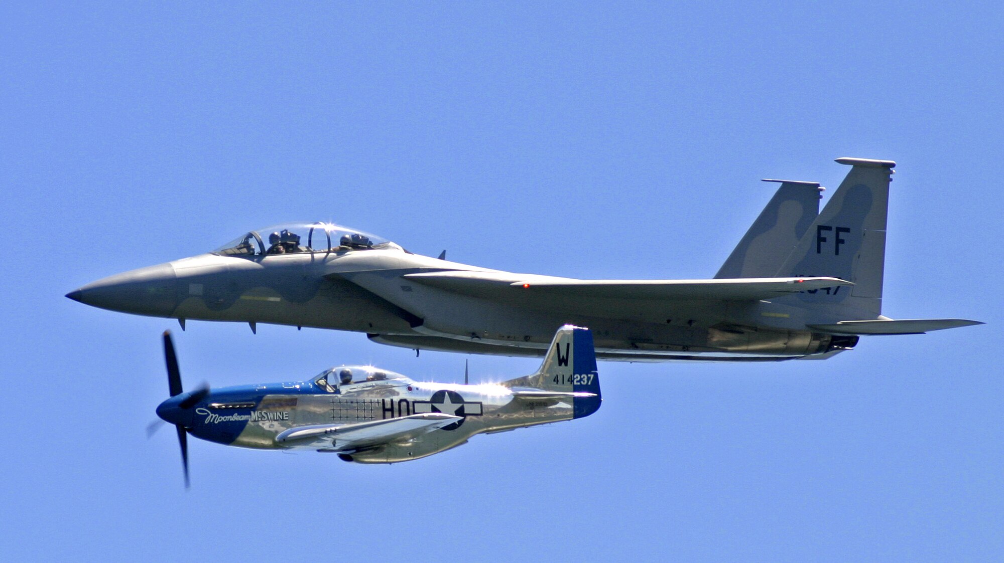An F-15E Strike Eagle flies with a World War II-era North American P-51 Mustang. The two aircraft performed at an air show in Milwaukee July 15 and 16. (U.S. Air Force photo/Master Sgt. Kenneth Pagel) 
