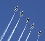 F-16 Fighting Falcons of the U.S. Air Force Air Demonstration Squadron, the Thunderbirds, perform a climbing turn at an air show in Milwaukee on July 15. (U.S. Air Force photo/Master Sgt. Kenneth Pagel) 