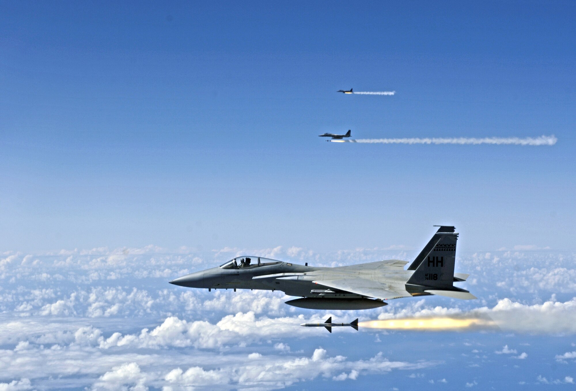 F-15 Eagles fire AIM-7 Sparrow missiles at a tactical air-launched decoy off the coast of Hawaii on July 16 during the Rim of the Pacific Exercise 2006. The F-15s are from the Hawaii Air National Guard's 199th Fighter Squadron. (U.S. Air Force photo/Tech. Sgt. Shane A. Cuomo) 