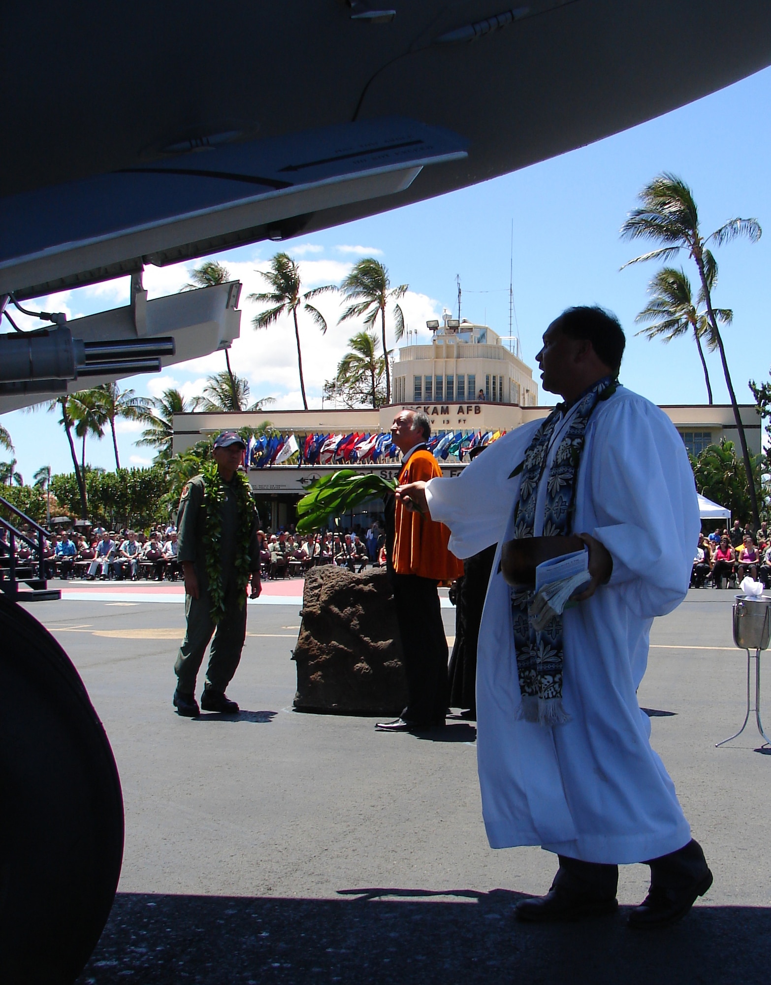 HICKAM AIR FORCE BASE, Hawaii -- Chaplain Kahu Kordell Kekoa, Kamehameha Schools chaplain, gives an Hawaiian blessing to the "Spirit of Kamehameha- Imua," which is the eighth and final C-17 for the 15th Airlift Wing at Hickam. It marks the successful transformation for the 15th AW from a support unit to an operational strategic airlift wing. The maintainers are active duty Airmen and Hawaii Air National Guardsmen. (Air Force photo by Major Brad Jessmer)