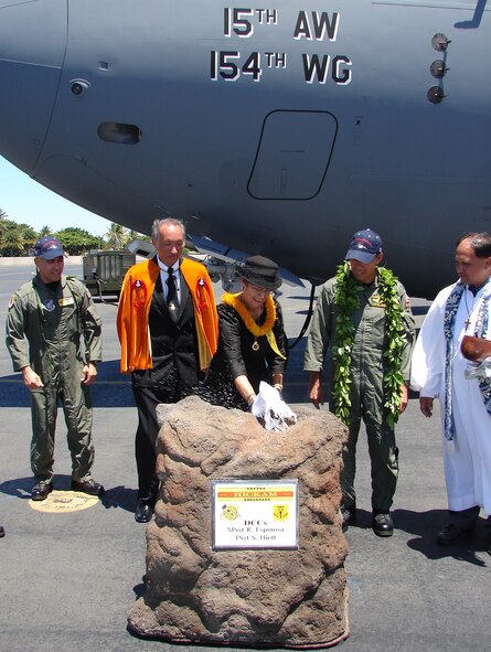 HICKAM AIR FORCE BASE, Hawaii -- (from left in rear) Colonel John J. Torres, 15th Airlift Wing commander, Ali`i Sir Keoni Agard, Royal Order of Kamehameha, Brigadier General Darryll Wong, Hawaii Air National Guard commander, and Kahu Kordell Kekoa, Kamehameha Schools chaplain, watch as Ms Donnalei Smythe, Ahahui Ka`ahumanu, christens the "Spirit of Kamehameha- Imua," which is the eighth and final C-17 for the 15th Airlift Wing at Hickam. It marks the successful transformation for the 15th AW from a support unit to an operational strategic airlift wing. The maintainers are active duty Airmen and Hawaii Air National Guardsmen. (Air Force photo by Major Brad Jessmer)