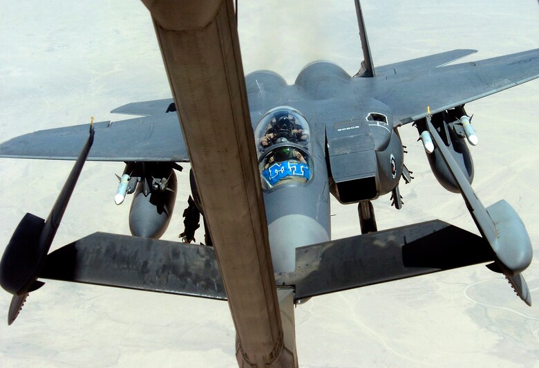 An F-15E Strike Eagle pulls up to the refueling boom of a KC-10 Extender while flying a close-air-support mission in support of Operation Iraqi Freedom on July 18. The KC-10 is with the 908th Expeditionary Air Refueling Squadron in Southwest Asia. (U.S. Air Force photo/Senior Airman Brian Ferguson)