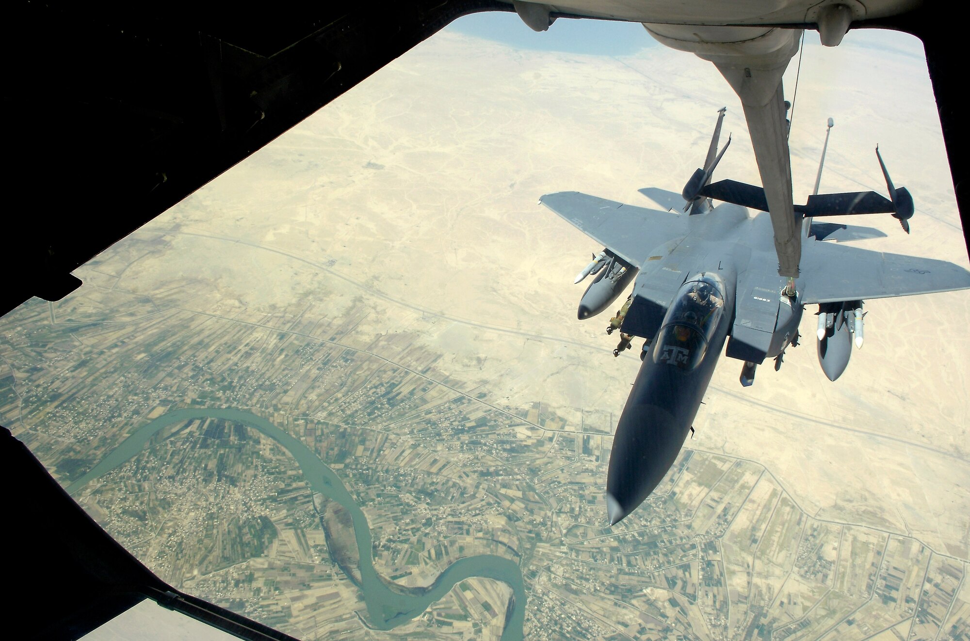 An F-15E Strike Eagle gets fuel from a KC-10 Extender over Baghdad, Iraq, on July 18. The F-15 was flying a close-air-support mission in support of Operation Iraqi Freedom. The KC-10 is with the 908th Expeditionary Air Refueling Squadron in Southwest Asia. (U.S. Air Force photo/Senior Airman Brian Ferguson)
