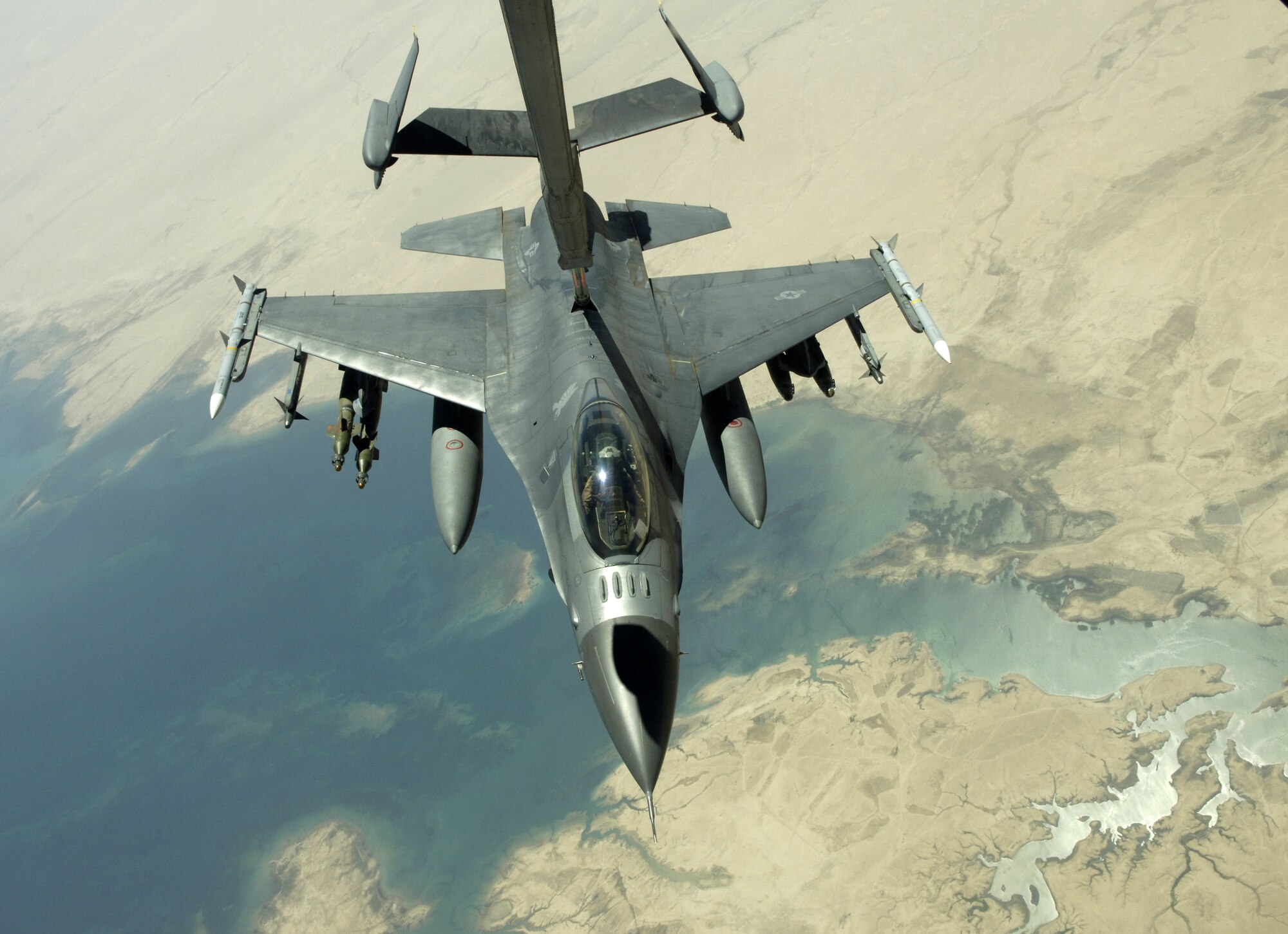 An F-16 Fighting Falcon refuels from a KC-10 Extender while flying a close-air-support mission over Iraq in support of Operation Iraqi Freedom on July 18. The KC-10 is with the 908th Expeditionary Air Refueling Squadron in Southwest Asia. (U.S. Air Force photo/Senior Airman Brian Ferguson)

