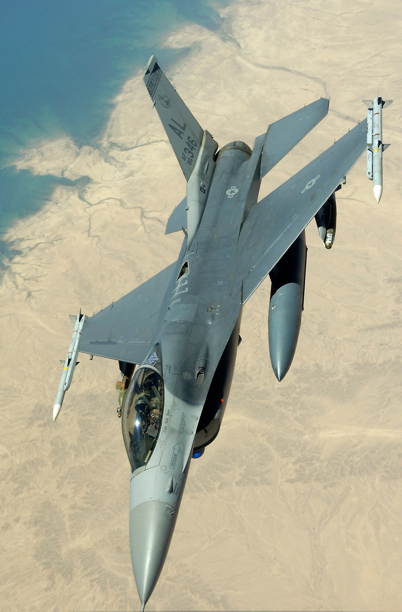 An F-16 Fighting Falcon flies a close-air-support mission over Iraq in support of Operation Iraqi Freedom on July 18. The F-16 is an Alabama Air National Guard plane, deployed to the area. (U.S. Air Force photo/Senior Airman Brian Ferguson)
