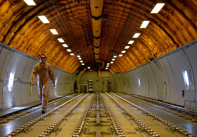 Master Sgt. Todd McPeak walks back from the refueling pod of a KC-10 Extender during an Operation Iraqi Freedom mission on July 18. Sergeant McPeak is a boom operator for the 908th Expeditionary Air Refueling Squadron in Southwest Asia. (U.S. Air Force photo/Senior Airman Brian Ferguson)