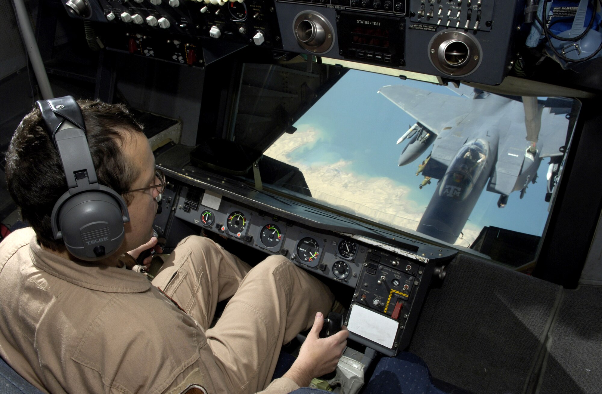 Master Sgt. Todd McPeak refuels an F-15E Strike Eagle during an Operation Iraqi Freedom mission on July 18. Sergeant McPeak is a KC-10 Extender boom operator with the 908th Expeditionary Air Refueling Squadron. (U.S. Air Force photo/Senior Airman Brian Ferguson) 

