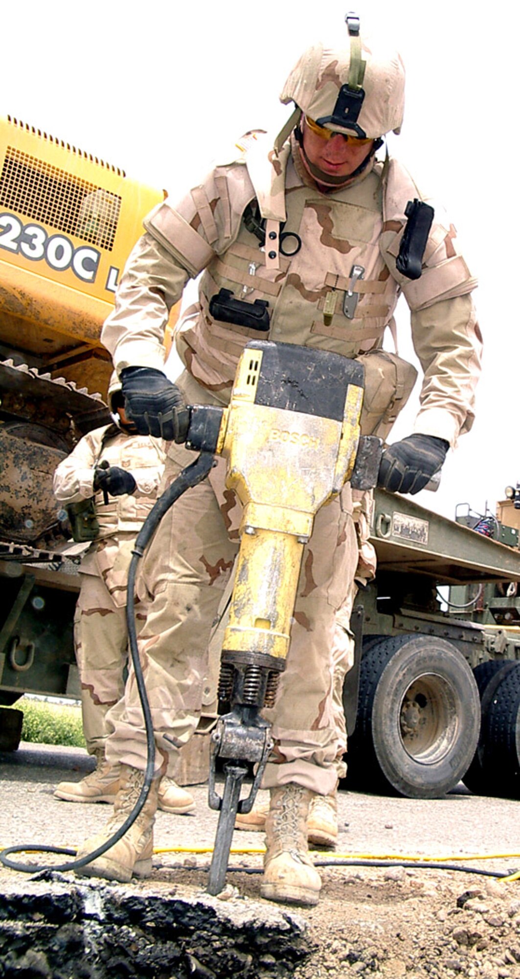 Tech. Sgt. Mattheu Gustafson uses a jackhammer to prepare an improvised explosive device crater for concrete on Monday, July 17, in Iraq. Members of the 732nd Expeditionary Civil Engineer Squadron's Detachment 10 are responsible for maintaining and repairing convoy routes and construction projects at forward-operating bases in Iraq. (Courtesy photo)