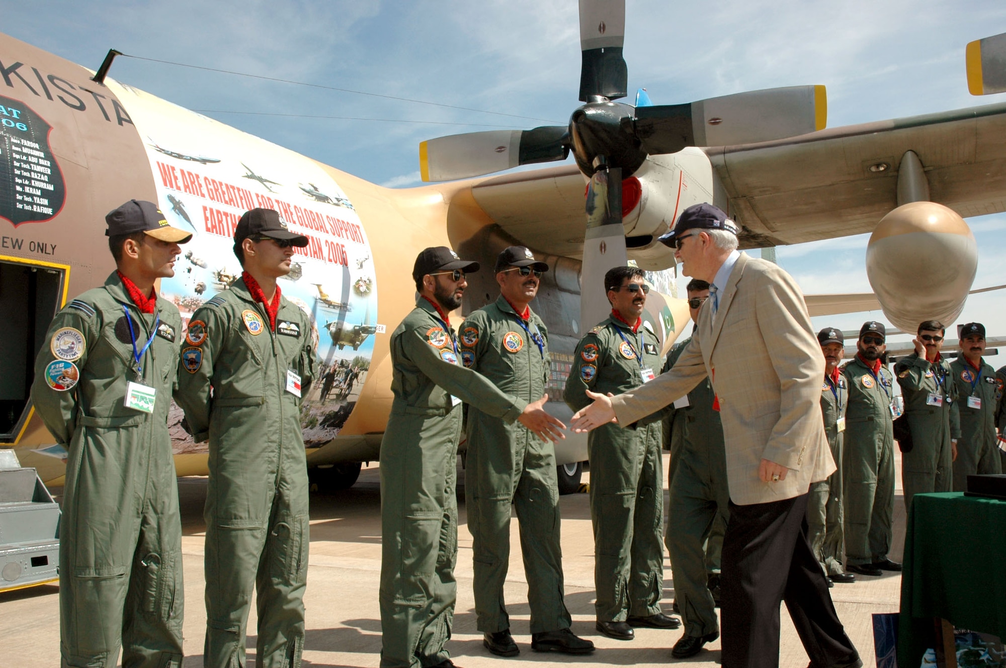 Secretary of the Air Force Michael W. Wynne greets members of the Pakistan Air Force during his visit to the Royal International Air Tattoo in England. The Pakistani airmen used the air show as an opportunity to say "thank you" for the international support their country received after the October earthquake that killed more than 73,000 people. (U.S. Air Force photo/Master Sgt. Chuck Roberts)