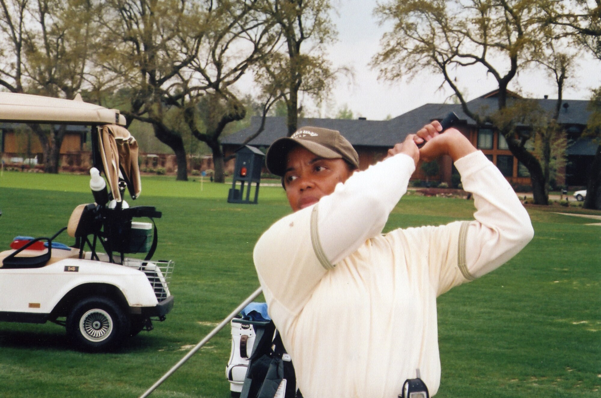 Addie Cobb, Quiet Pines operations clerk and golf instructor here, watches the ball after hitting a drive. Mrs. Cobb was recently selected for the position of contributing editor of the African American Golfer’s Digest, a quarterly publication. (Courtesy photo)