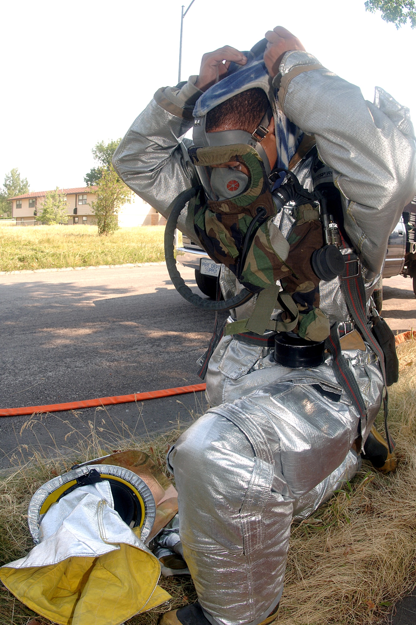 Senior Airman Kevin Ferguson removes his mask after a simulated fire at Ellsworth Air Force Base, S.D., on July 19. The scenario was part of an operational readiness inspection. Airman Ferguson is with the 28th Civil Engineer Squadron. (U.S. Air Force photo/Airman 1st Class Melissa Flores) 
