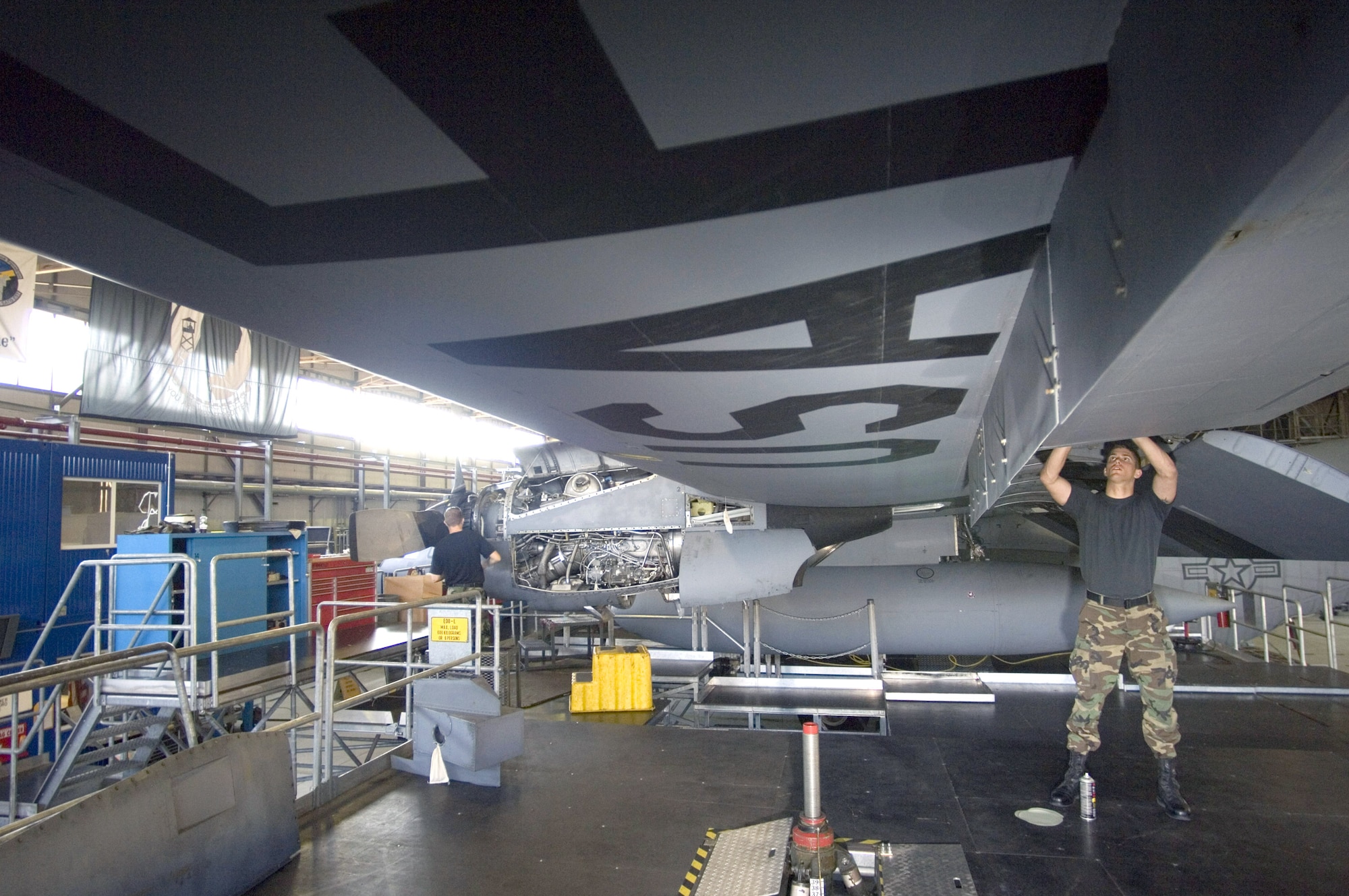 Airman 1st Class Edward Hall applies fabrication patches to the wing of a C-130 Hercules during an isochronical inspection at Ramstein Air Base, Germany, on July 18. Airman Hall, of Delray Beach, Fla., is a crew chief with the 86th Maintenance Squadron. (U.S. Air Force photo/Master Sgt. John E. Lasky) 
