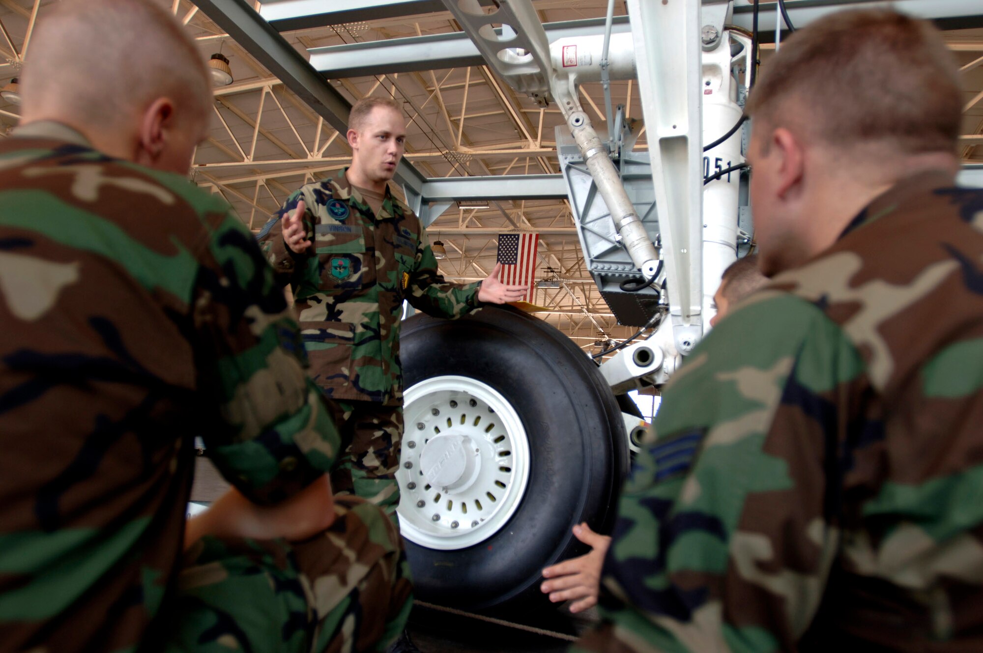 Tech. Sgt. Michael Vinson instructs Air Force technical training students on the maintenance of a KC-135 Stratotanker main landing gear using a fully functional training replica. Sergeant Vinson is an aerospace maintenance instructor at Sheppard Air Force Base, Texas. (U.S. Air Force photo/Tech. Sgt. Cecilio M. Ricardo Jr.)