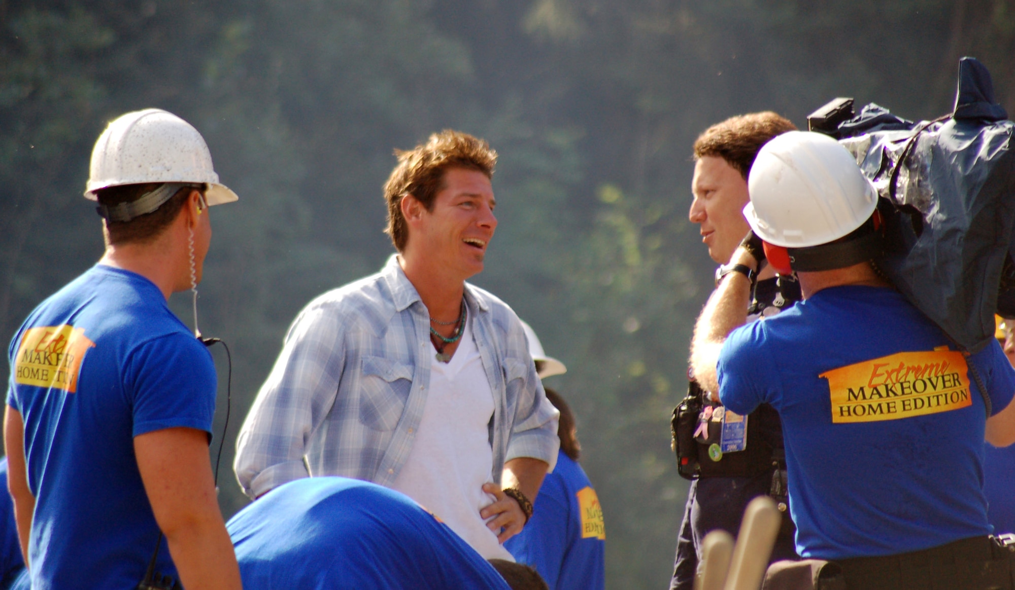 Ty Pennington, the star of ABC's "Extreme Makeover: Home Edition," jokes with members of the production crew during the filming of the "Rogers Family" episode in North Pole, Alaska. Approximately 180 military members from Elmendorf and Eielson Air Force Bases, and Forts Richardson and Wainwright helped build a house for a woman and her 12 family members. (U.S. Air Force photo/Master Sgt. Tommie Baker)