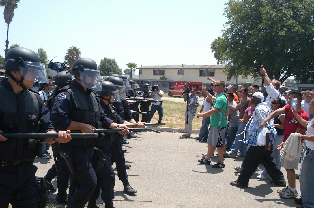 Members of the Los Angeles Police Department, Metropolitan Division, quell a mock mob who was demonstrating because they lacked access to basic services such as food, water and adequate shelter. (Official U. S. Marine Corps photo by SSgt P.I. Cox)