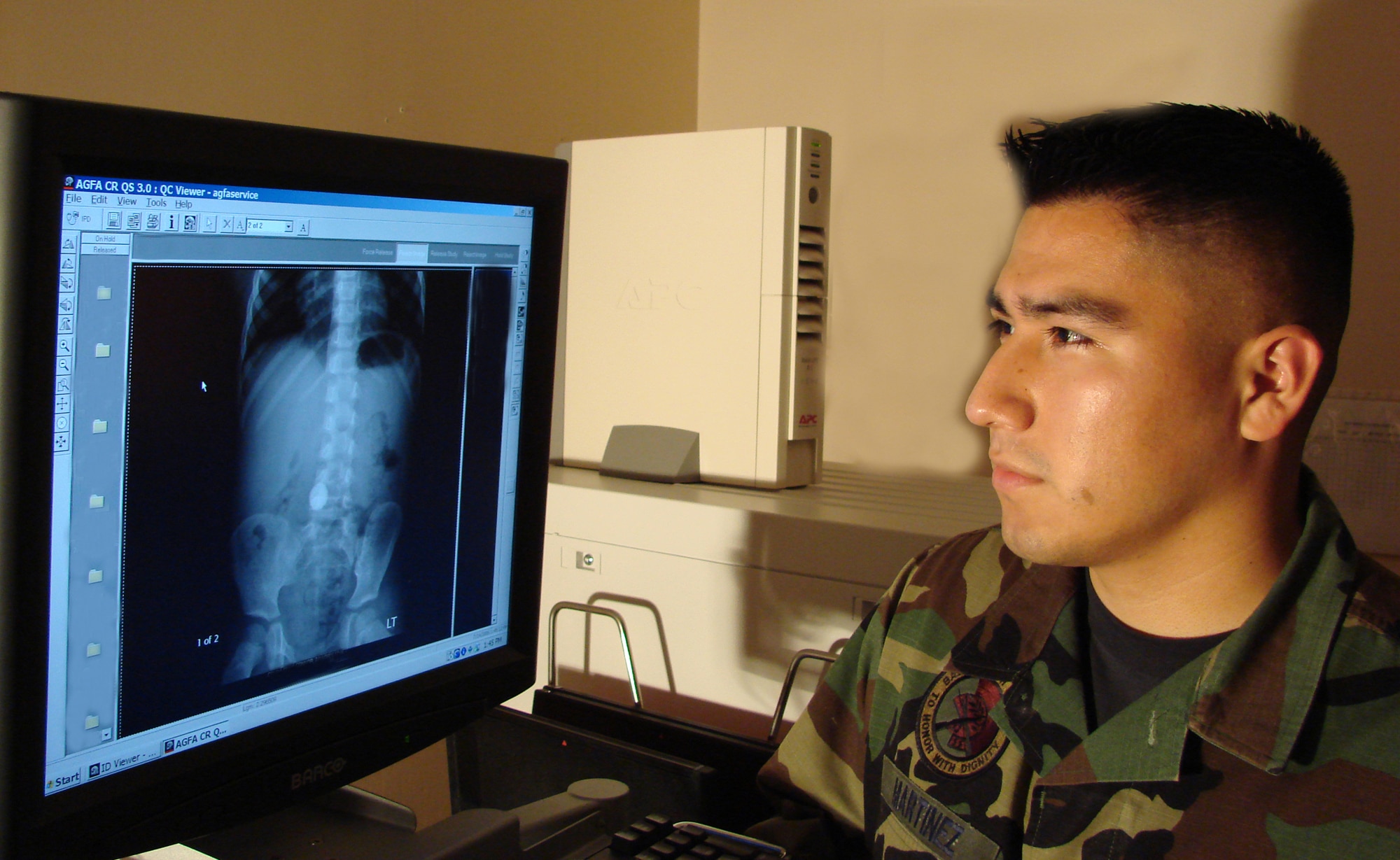 Staff Sgt. Gilbert Martinez, 71st Medical Support Squadron diagnostics imaging journeyman and photo archiving and communications system administrator, reviews one of the digital X-ray images following the conversion to the new system. (Photo Illustration by Frank McIntyre)