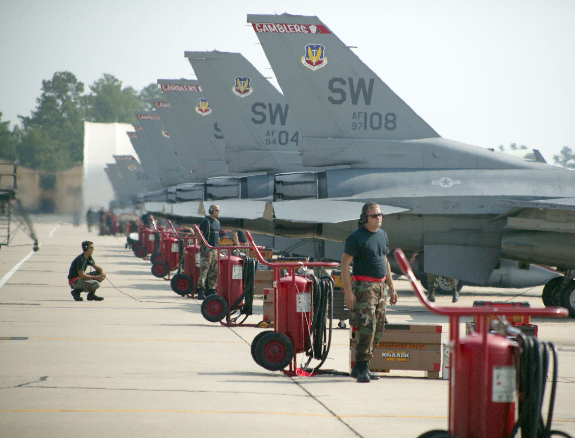 Maintainers from the 77th Aircraft Maintenance Unit's "Big Red Machine" prepare F-16's Monday. (U.S. Air Force photo/Senior Airman John Gordinier)