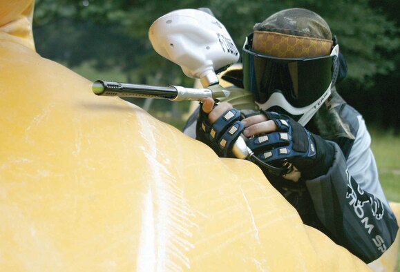Staff Sgt. Christpher Watkins, 20th Civil Engineer Squadron utilities systems craftsman, shoots at the opposing team during paintball practice Sunday at the Palmetto Paintball field.  (U.S. Air Force photo/Senior Airman John Gordinier)